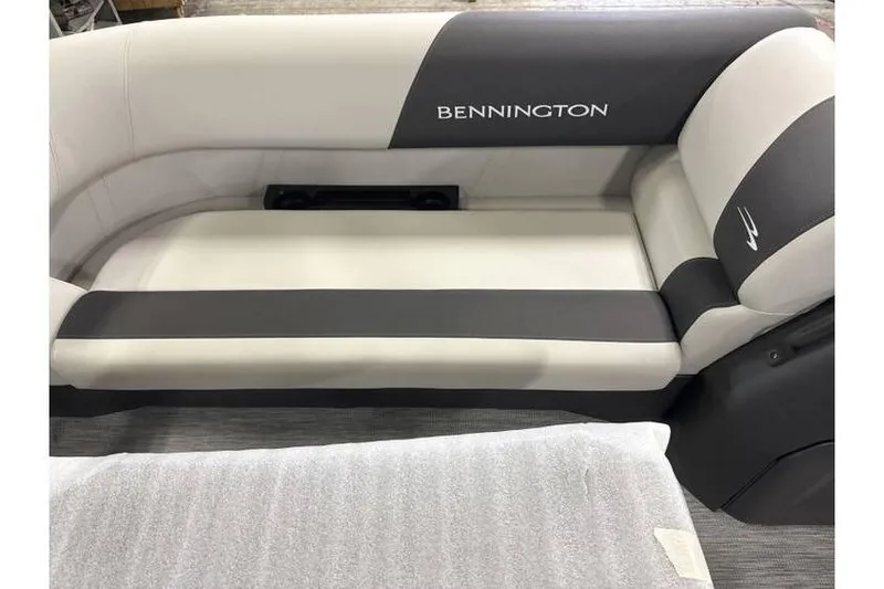 Slide: The Image of 2026 Bennington 20 SSR Quad Bench Tritoon interior seating, featuring elegant gray and white upholstery. - 5