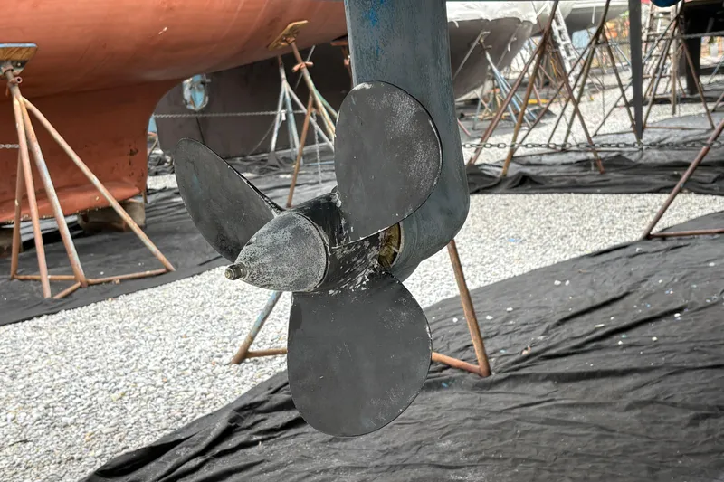 Slide: The Image of Propeller of a 2021 Beneteau Oceanis 38.1 sailboat in a boatyard setting. - 22