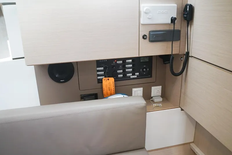 Slide: The Image of Interior control panel of a 2021 Beneteau Oceanis 38.1 yacht, featuring modern navigation equipment. - 25
