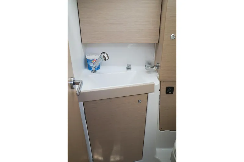 Slide: The Image of Beneteau Oceanis 38.1 2021 bathroom sink with modern faucet and storage cabinet. - 34