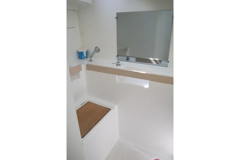 Slide: The Image of Bathroom interior of 2021 Beneteau Oceanis 38.1 yacht, featuring a mirror and compact design. - 35