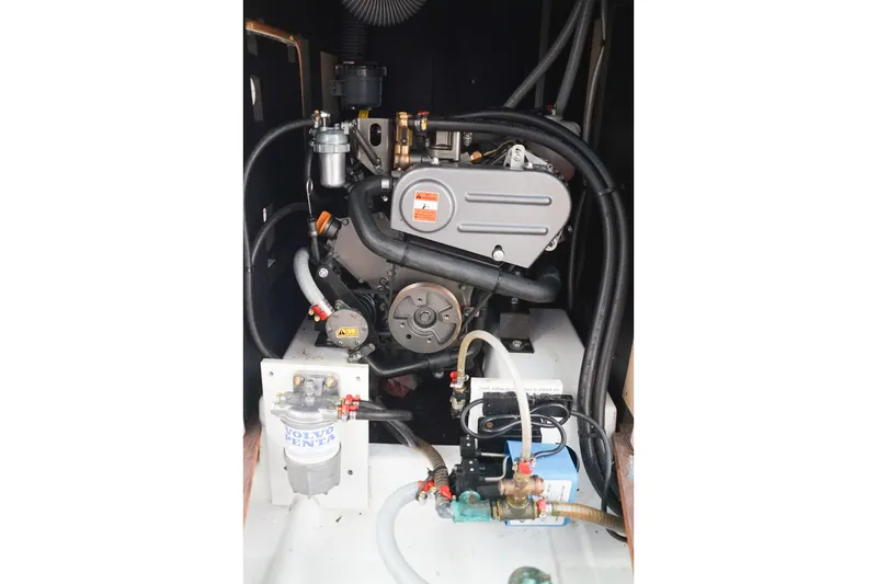 Slide: The Image of Engine compartment of a 2021 Beneteau Oceanis 38.1 sailboat, featuring a Volvo Penta engine. - 37