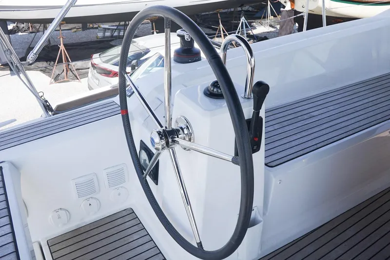 Slide: The Image of Steering wheel of a 2021 Beneteau Oceanis 38.1 yacht, featuring sleek design. - 38