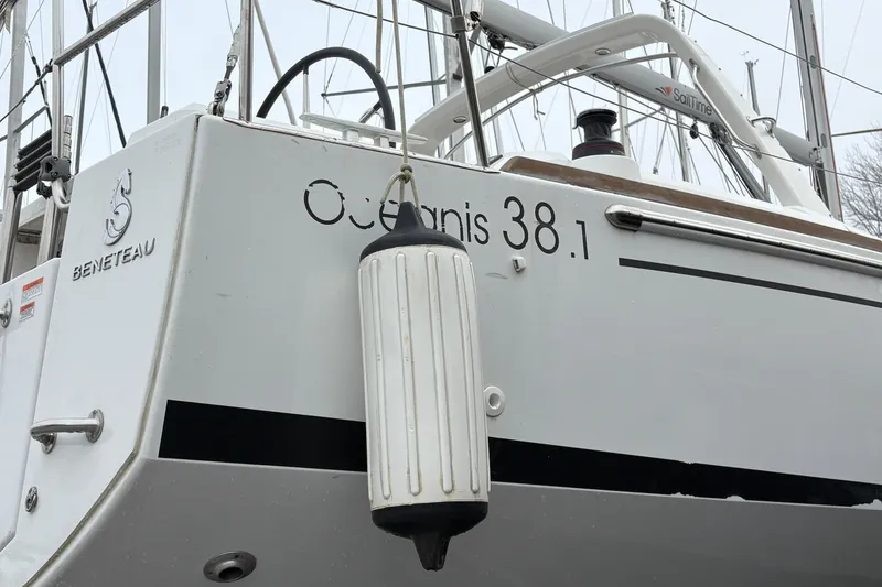 Slide: The Image of Beneteau Oceanis 38.1 sailboat, 2021 model, docked with visible fender. - 4