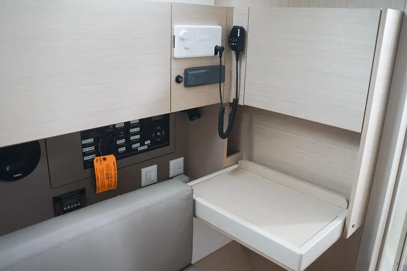 Slide: The Image of Interior of 2021 Beneteau Oceanis 38.1 yacht with control panel and communication equipment. - 40