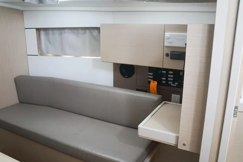 Slide: The Image of Interior of 2021 Beneteau Oceanis 38.1 yacht with modern seating and control panel. - 41