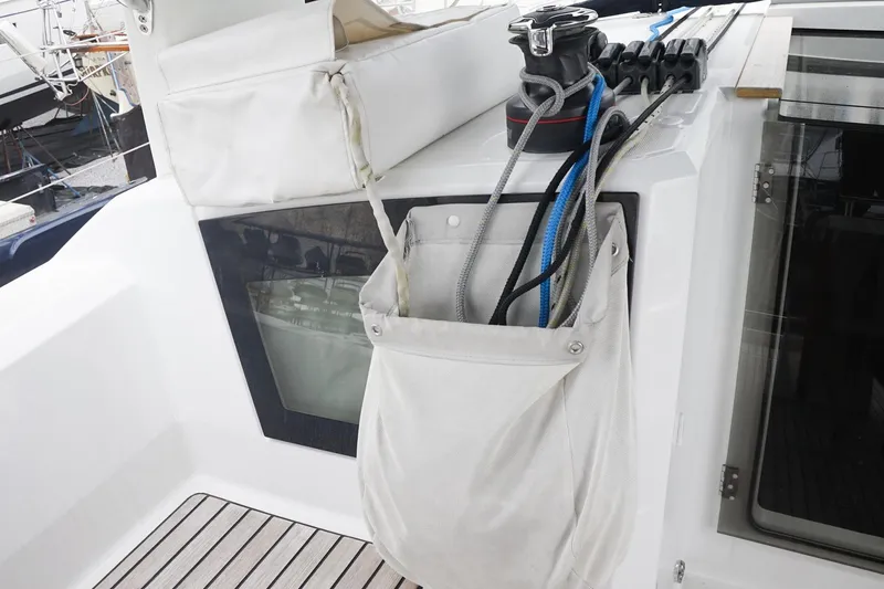 Slide: The Image of Beneteau Oceanis 38.1 sailboat deck with ropes and winch, 2021 model. - 45