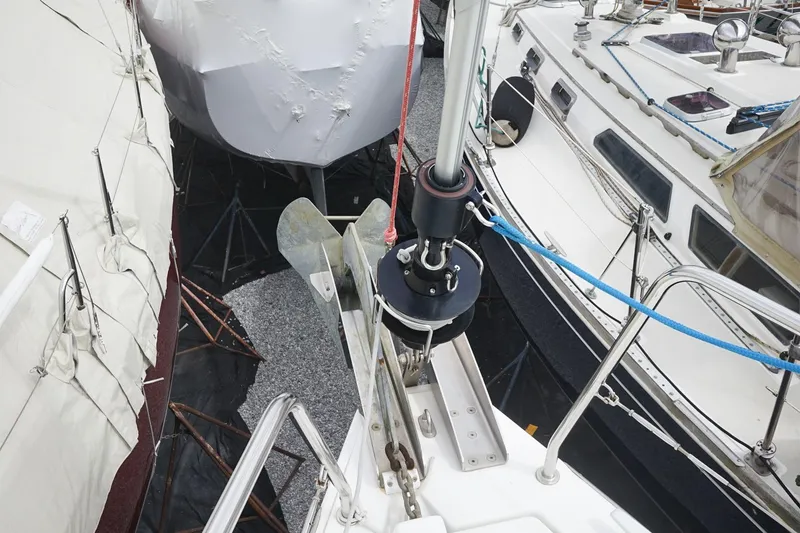 Slide: The Image of Beneteau Oceanis 38.1 sailboat, 2021 model, docked among other boats in a marina. - 47