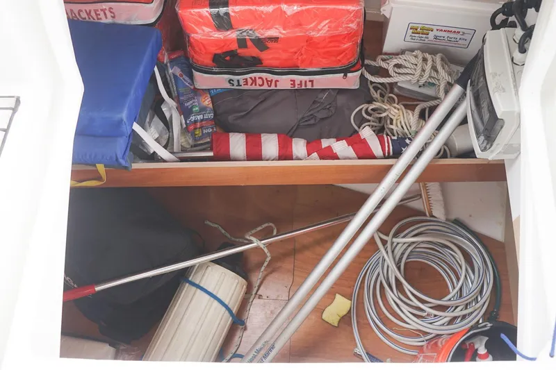Slide: The Image of Storage compartment of 2021 Beneteau Oceanis 38.1 with life jackets and sailing gear. - 48