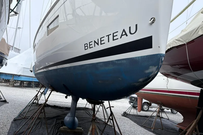 Slide: The Image of 2021 Beneteau Oceanis 38.1 sailboat on stands, hull view in a boatyard. - 5