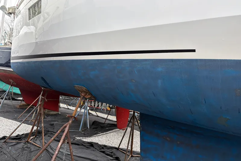 Slide: The Image of Beneteau Oceanis 38.1 sailboat, 2021 model, on stands for maintenance. - 6