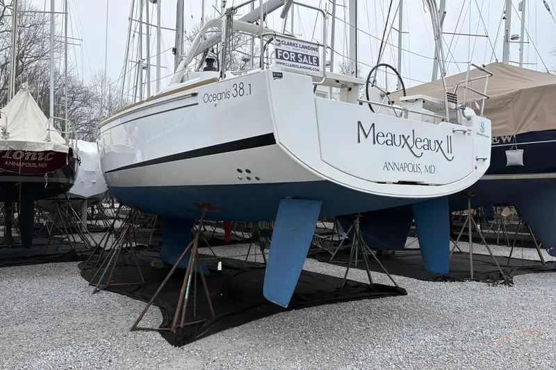 Slide: The Image of Beneteau Oceanis 38.1 sailboat, 2021 model, docked in Annapolis, MD, with "For Sale" sign. - 7