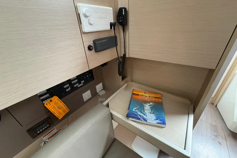 Slide: The Image of Interior of 2021 Beneteau Oceanis 38.1 yacht with navigation equipment and chart. - 9