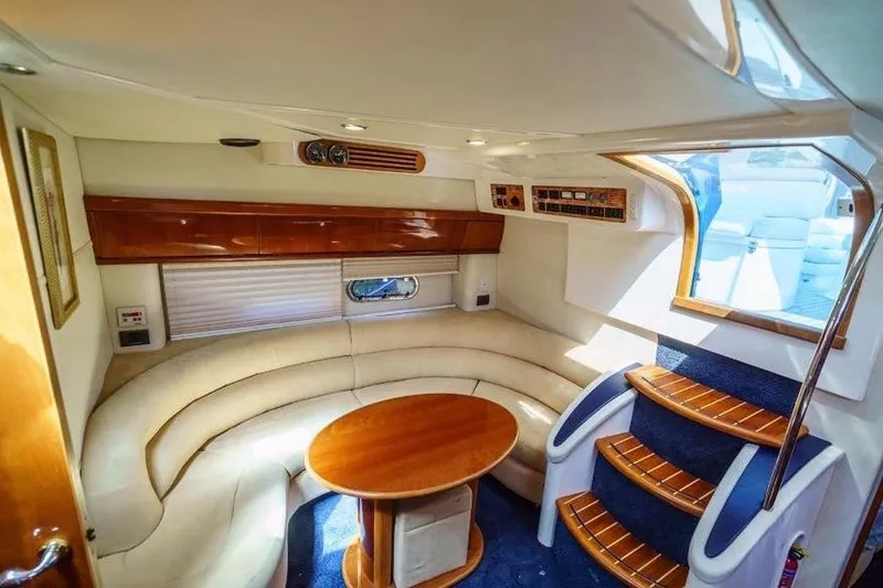 Slide: The Image of Interior of 2001 Sealine S41 Sports Cruiser with elegant seating and wooden accents. - 14
