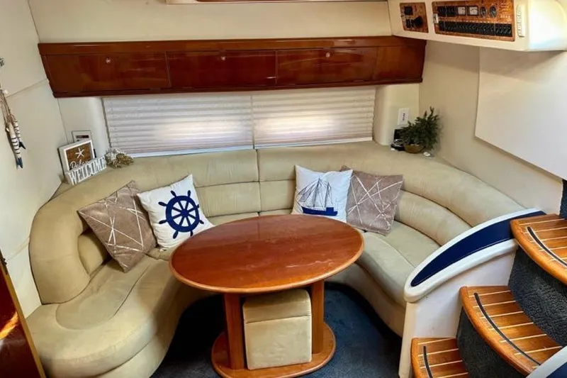 Slide: The Image of Interior of 2001 Sealine S41 Sports Cruiser with cozy seating and nautical decor. - 15