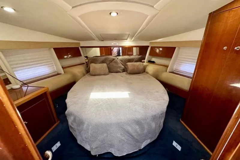 Slide: The Image of Luxurious cabin interior of 2001 Sealine S41 Sports Cruiser with cozy bedding. - 18