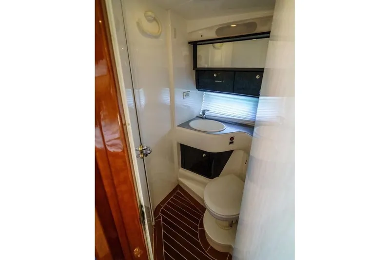 Slide: The Image of 2001 Sealine S41 Sports Cruiser bathroom with modern fixtures and wood accents. - 20