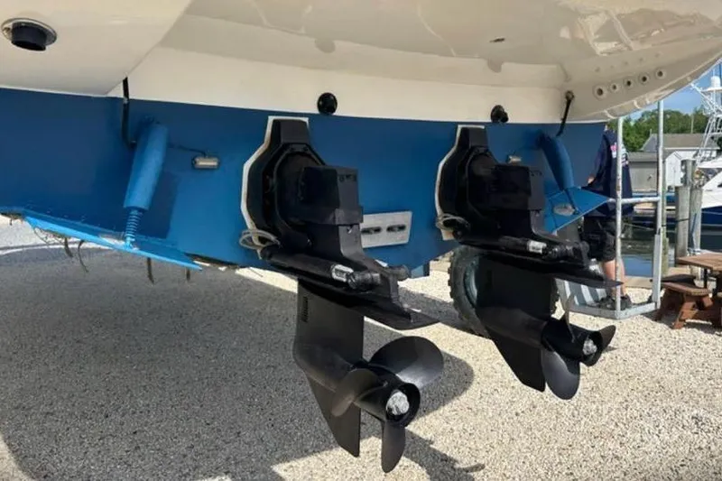 Slide: The Image of 2001 Sealine S41 Sports Cruiser with dual propellers, displayed on gravel surface. - 22