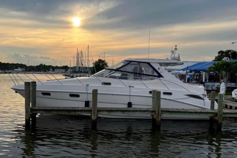 Slide: The Image of 2001 Sealine S41 Sports Cruiser docked at sunset, serene marina backdrop. - 3