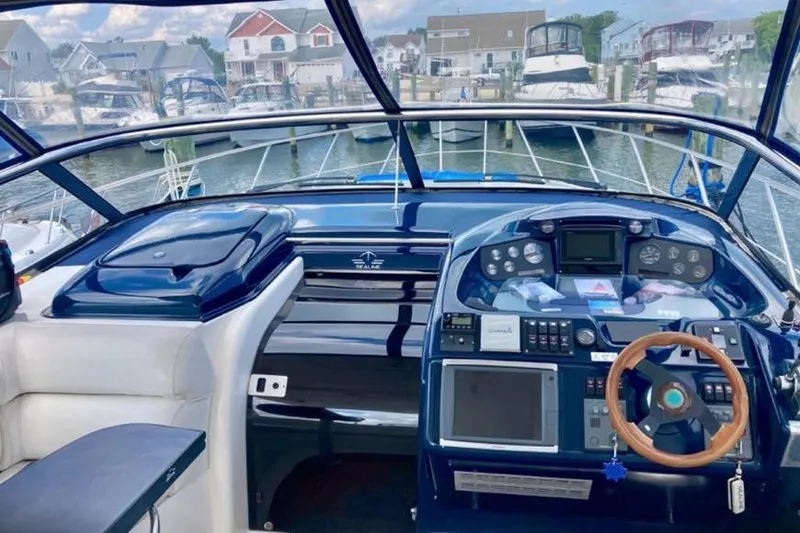 Slide: The Image of Cockpit of 2001 Sealine S41 Sports Cruiser with modern navigation equipment. - 6