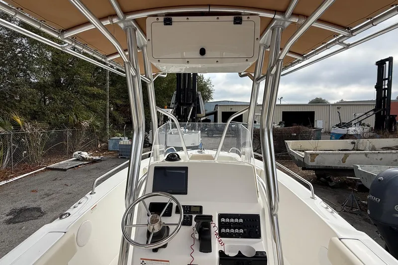 Slide: The Image of 2020 Edgewater 208CC boat interior with steering wheel and control panel. - 10