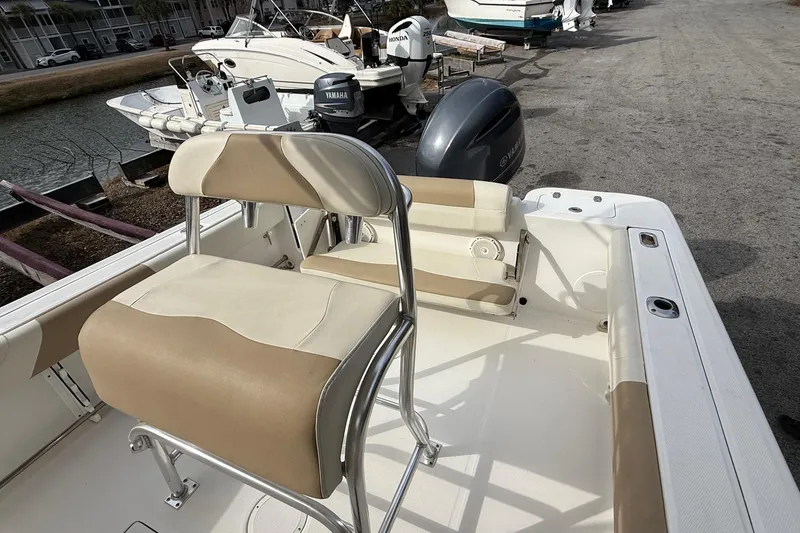 Slide: The Image of 2020 Edgewater 208CC boat interior with seating and Yamaha outboard motor. - 16