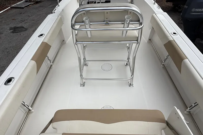 Slide: The Image of 2020 Edgewater 208CC boat interior with seating and stainless steel railings. - 18
