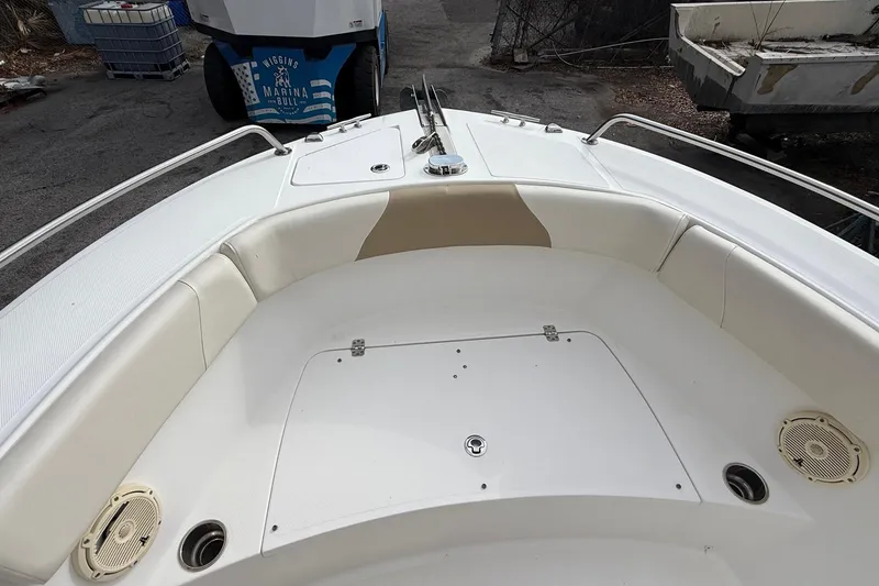 Slide: The Image of 2020 Edgewater 208CC boat interior with seating and storage compartments. - 24