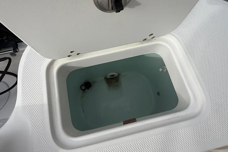 Slide: The Image of Open livewell on 2020 Edgewater 208CC boat, filled with water. - 28