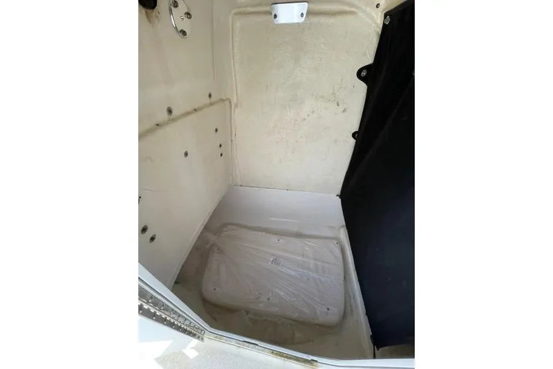 Slide: The Image of Interior view of 2020 Edgewater 208CC boat storage compartment. - 31