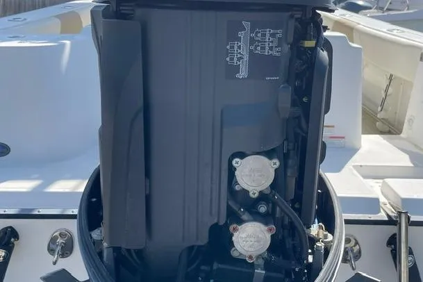 Slide: The Image of 2020 Edgewater 208CC boat engine close-up, showcasing detailed mechanical components. - 41