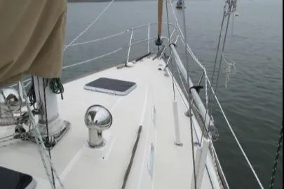 Slide: The Image of 1989 Sabre 34 MK II sailboat deck, featuring clean lines and sturdy rigging. - 2