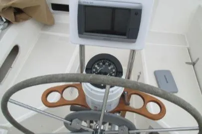 Slide: The Image of 1989 Sabre 34 MK II yacht cockpit with steering wheel and navigation instruments. - 4