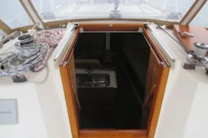 Slide: The Image of 1989 Sabre 34 MK II sailboat cockpit with open cabin door and visible interior. - 5