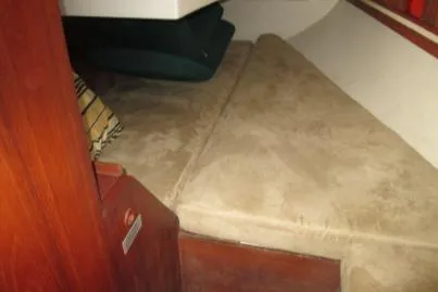 Slide: The Image of 1989 Sabre 34 MK II cabin interior with beige cushions and wooden accents. - 8