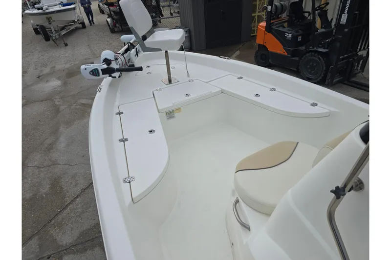 Slide: The Image of 2018 NauticStar 2140 Sport boat interior with seating and storage compartments. - 13