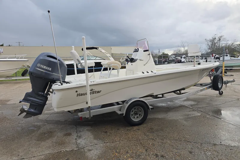 Slide: The Image of 2018 NauticStar 2140 Sport boat on trailer with Yamaha outboard motor. - 7