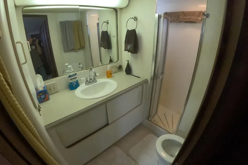 Slide: The Image of Bathroom interior of 1987 Hatteras 54 Motor Yacht with sink, mirror, and shower. - 30
