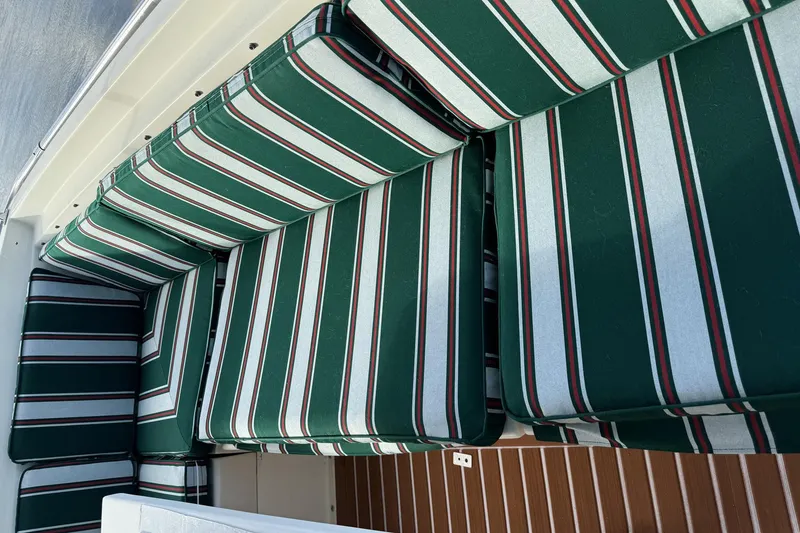 Slide: The Image of Striped green and white cushions on 1987 Hatteras 54 Motor Yacht deck seating. - 39