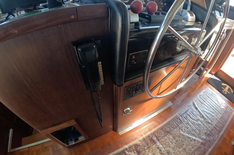 Slide: The Image of Interior helm of 1987 Hatteras 54 Motor Yacht with steering wheel and controls. - 57