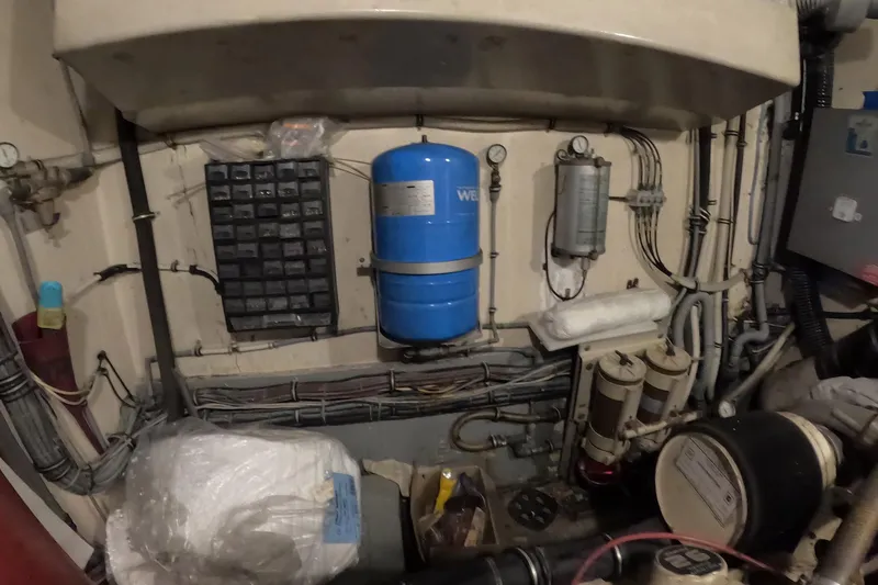 Slide: The Image of Engine room of 1987 Hatteras 54 Motor Yacht with equipment and wiring. - 59
