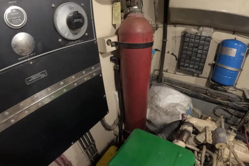 Slide: The Image of Engine room of 1987 Hatteras 54 Motor Yacht with control panel and equipment. - 61