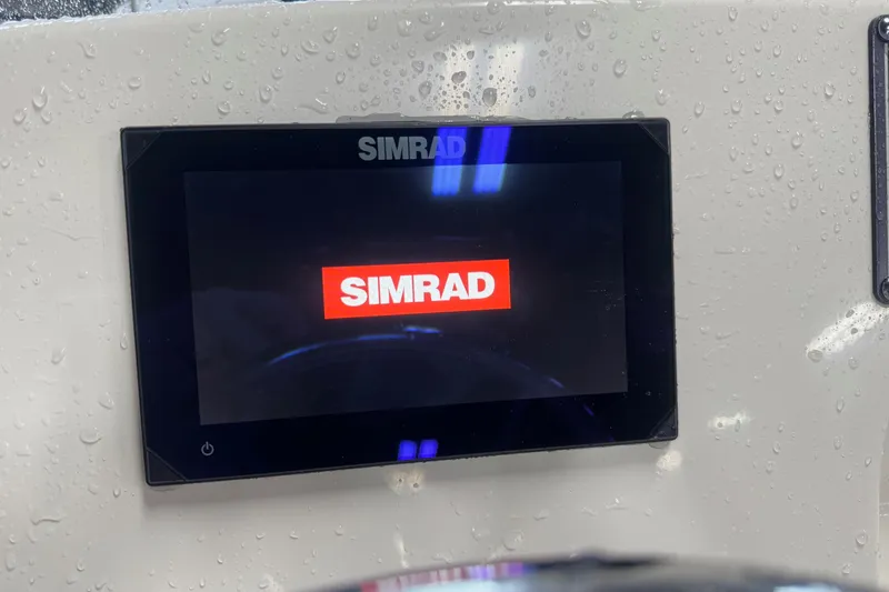 Slide: The Image of Simrad display on 2024 Boston Whaler 150 Montauk, with water droplets on the surface. - 15