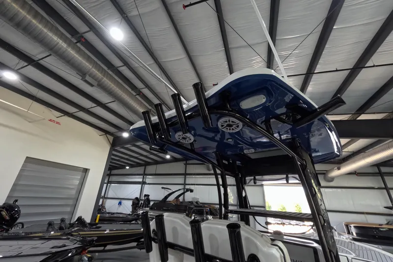 Slide: The Image of 2024 Tidewater boat in a warehouse, showcasing its sleek design and modern features. - 10