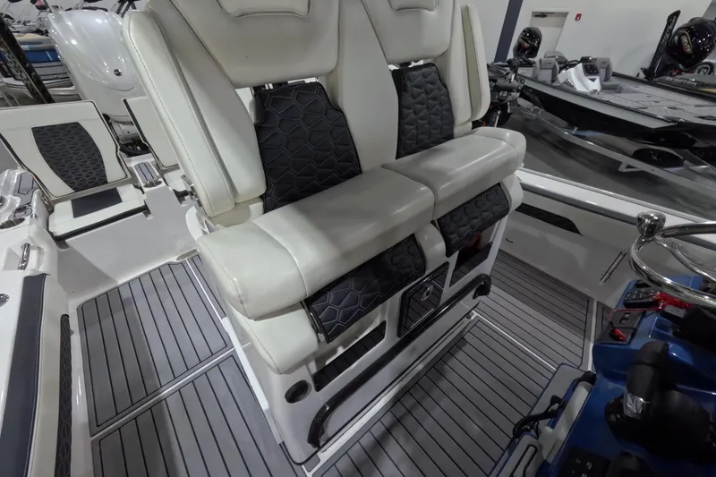 Slide: The Image of 2024 Tidewater boat interior with cushioned seating and modern design. - 11