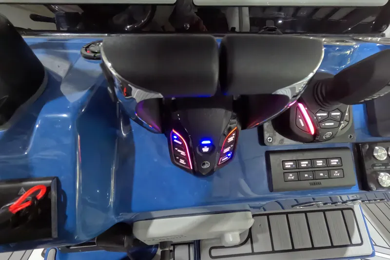 Slide: The Image of 2024 Tidewater boat control panel with illuminated throttle and navigation controls. - 16