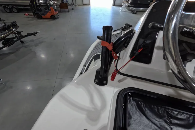 Slide: The Image of 2024 Tidewater boat interior with steering wheel and control panel in a showroom. - 20