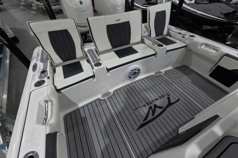 Slide: The Image of 2024 Tidewater boat interior with cushioned seating and branded flooring. - 8