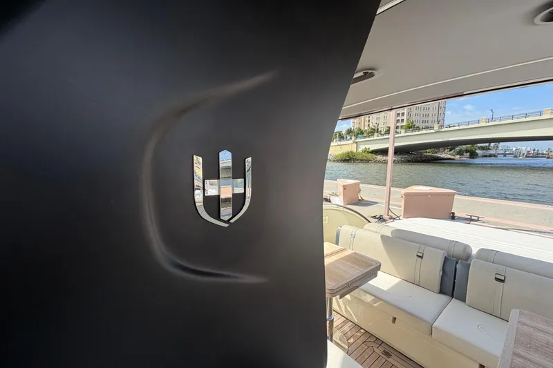 Slide: The Image of 2024 Invictus TT460 yacht interior with sleek design and waterfront view. - 12