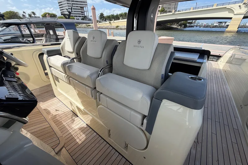 Slide: The Image of Luxurious seating on 2024 Invictus TT460 yacht with elegant design and waterfront view. - 18